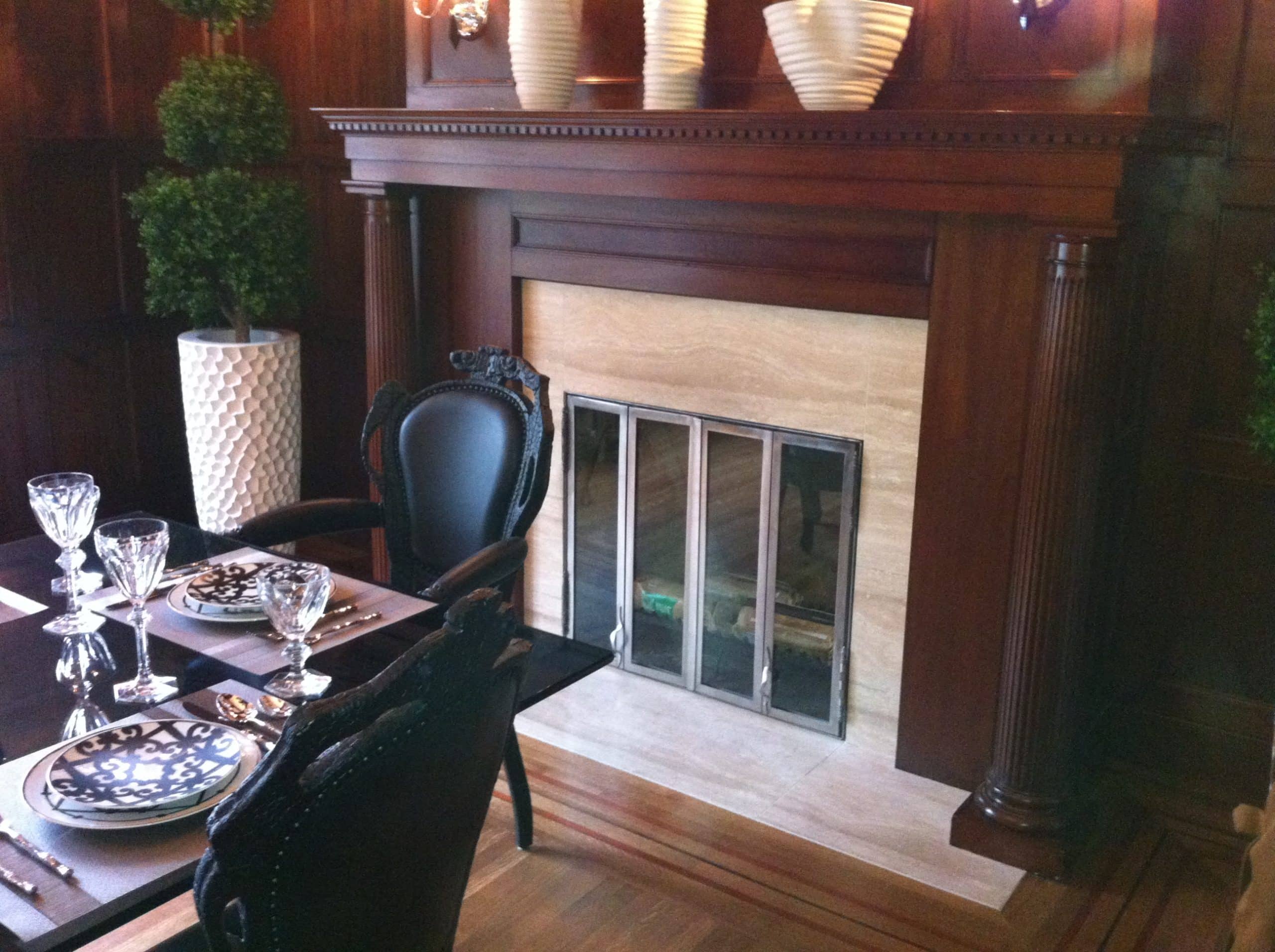 dining room with a fireplace and a table elegantly