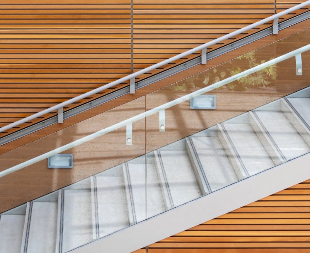 A modern stairway with handrails for stairs, providing a sleek and elegant design. 