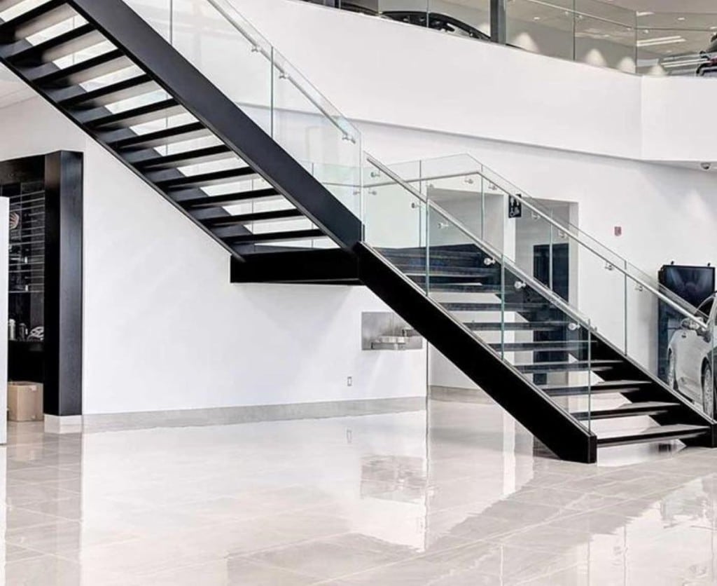 1. Modern staircase in large building with handrail. 
